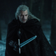 Henry Cavill, having long hair and a sword in Netflix’s The Witcher.